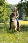 woman rides Icelandic horse