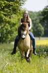 woman rides Icelandic horse