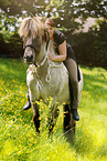 woman rides Icelandic horse