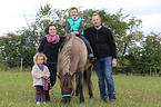 family and Icelandic horse