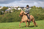 woman rides Icelandic horse