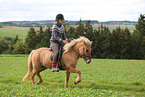 woman rides Icelandic horse