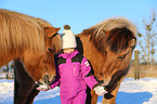 girl and Icelandic horses