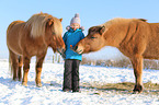 girl and Icelandic horses