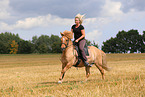 woman rides Icelandic horse