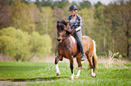 woman rides Icelandic horse