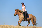 woman rides Icelandic Horse