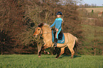 woman rides Icelandic horse