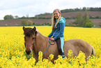 girl rides Icelandic horse