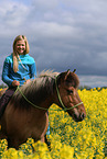 girl rides Icelandic horse