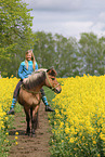 girl rides Icelandic horse