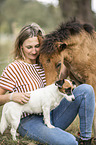 woman, dog and Icelandic horse foal