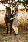 woman with icelandic horse and havanese