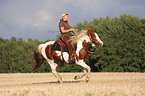 woman rides pony