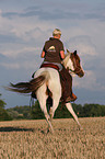 woman rides pony