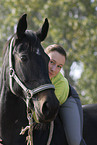 woman rides warmblood