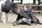 woman and Mini-Shetlandponys