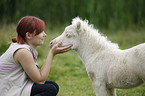 woman and Miniature Shetland Pony foal