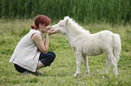 woman and Miniature Shetland Pony foal