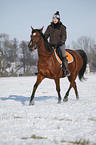 woman rides horse