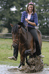 woman rides New Forest Pony