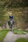 woman rides Oldenburg Horse