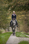 woman rides Oldenburg Horse