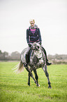 woman rides Oldenburg Horse