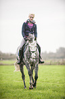 woman rides Oldenburg Horse