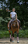 woman rides Oldenburg Horse