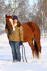 woman with Paint Horse in snow