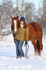 woman with Paint Horse in snow