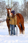 woman with Paint Horse in snow