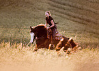 woman rides Paint Horse