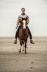 woman rides Paso Peruano