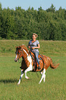 woman rides Pinto