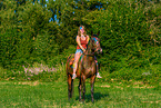 woman rides Polish Warmblood