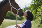 woman and Polish Warmblood