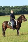 woman rides pony