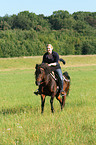 woman rides pony