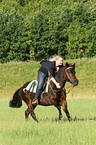 woman rides pony