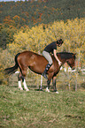 woman rides crossbreed