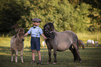boy and ponies