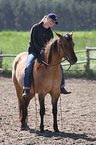 woman rides Quarter Horse