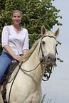 woman rides Quarter Horse