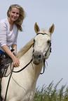 woman rides Quarter Horse