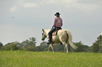 woman rides Quarter Horse