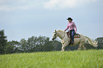 woman rides Quarter Horse