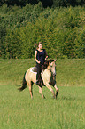 woman rides Quarter Horse