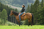 woman rides quarter horse